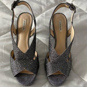 Hi! These are silver rhinestone cross strap heels from Alex Marie.